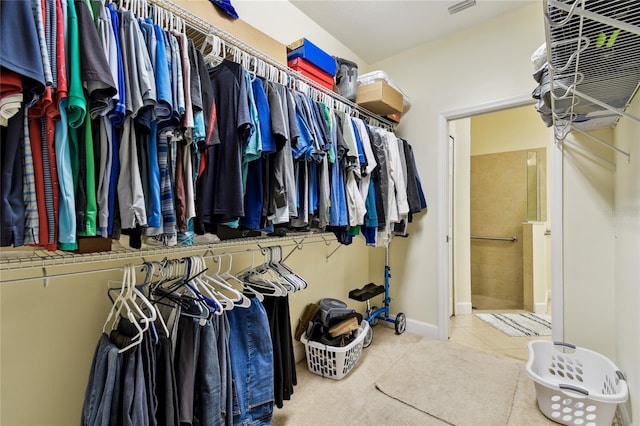 spacious closet featuring tile patterned floors