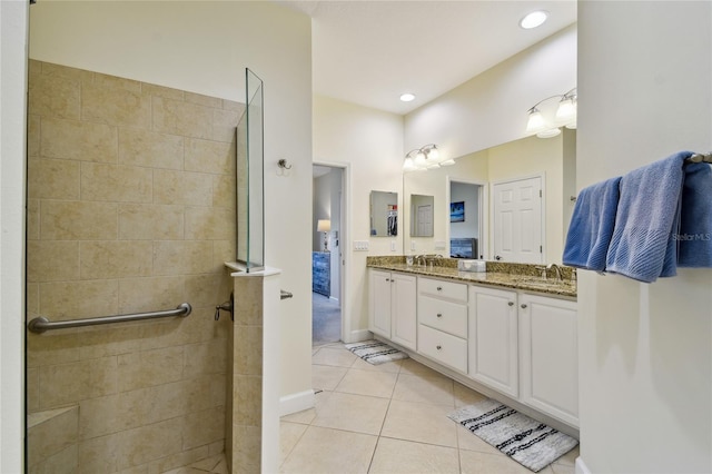 full bath featuring tile patterned floors, walk in shower, recessed lighting, and double vanity