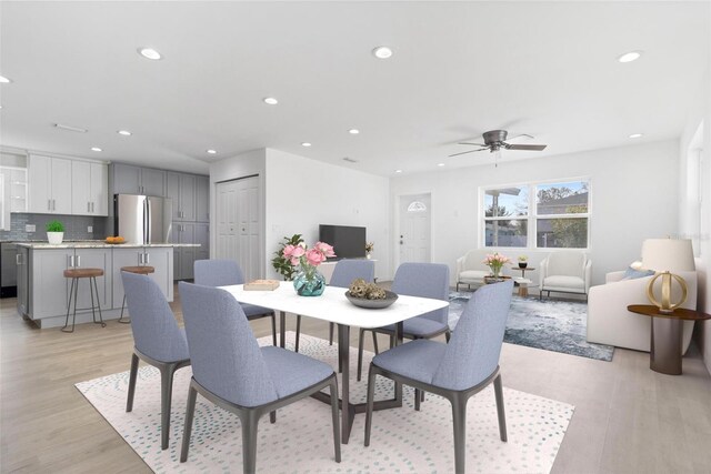 dining space with ceiling fan, light wood-type flooring, and recessed lighting