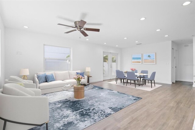 living room with ceiling fan, baseboards, wood finished floors, and recessed lighting