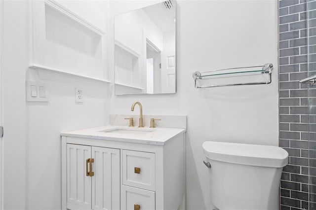 full bathroom featuring vanity and toilet