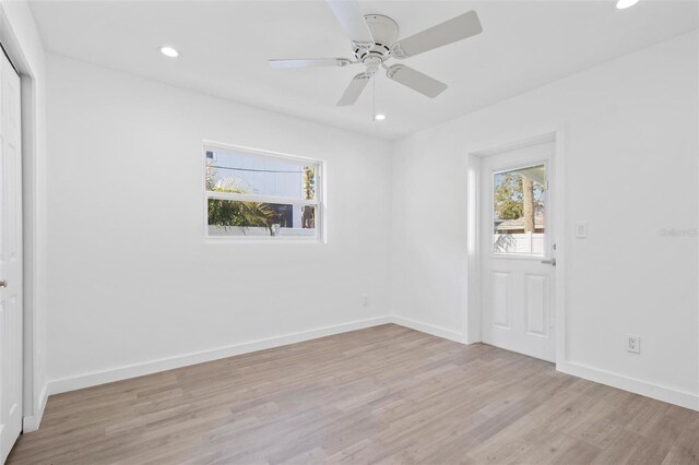 unfurnished room featuring light wood-type flooring, ceiling fan, baseboards, and recessed lighting