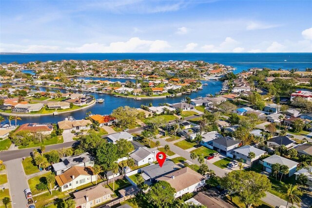 birds eye view of property with a residential view and a water view