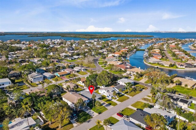 birds eye view of property featuring a water view and a residential view