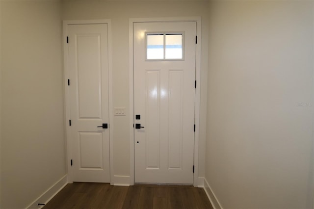 entryway featuring dark wood-style floors and baseboards