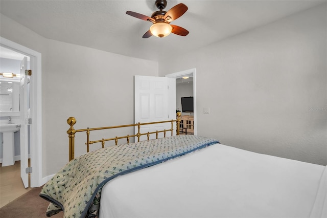 bedroom featuring ceiling fan and ensuite bathroom