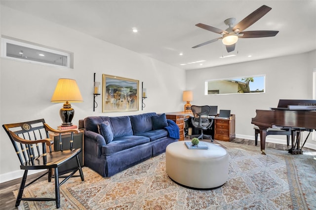 living room featuring a ceiling fan, baseboards, wood finished floors, and recessed lighting