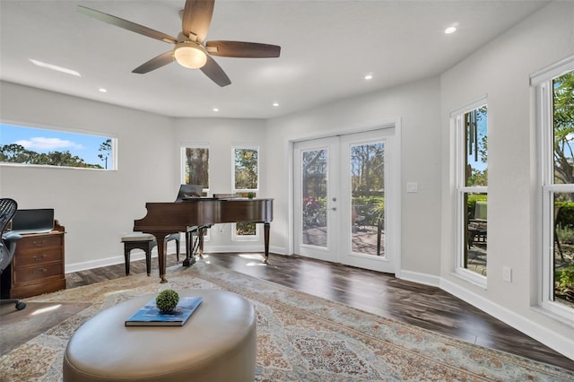 living area featuring recessed lighting, baseboards, wood finished floors, and french doors