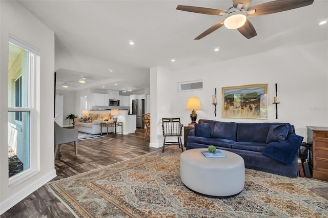 living room featuring dark wood-style floors, recessed lighting, visible vents, and ceiling fan