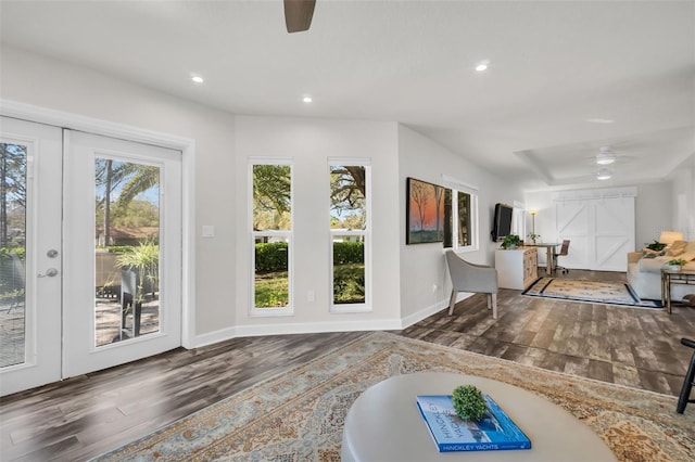 interior space featuring a ceiling fan, recessed lighting, and wood finished floors