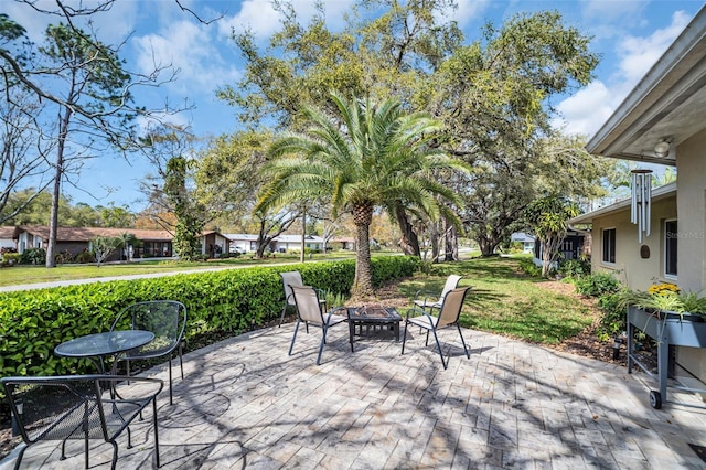 view of patio with a fire pit