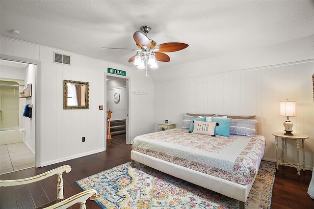 bedroom featuring a textured ceiling, visible vents, baseboards, a ceiling fan, and hardwood / wood-style floors