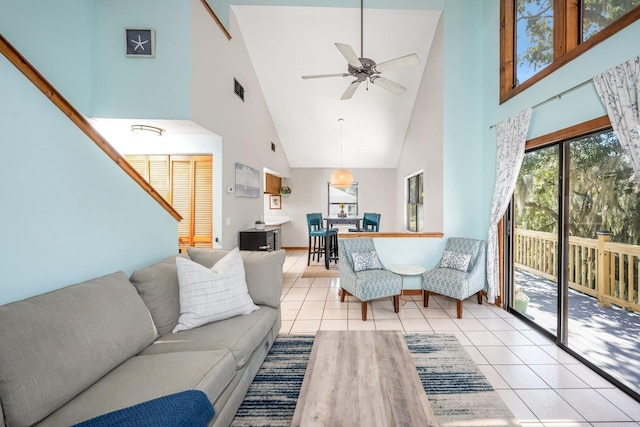 tiled living room featuring visible vents and ceiling fan
