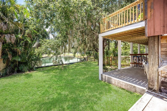 view of yard with a patio and a water view
