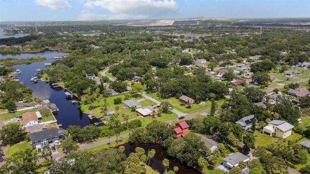 drone / aerial view with a residential view and a water view
