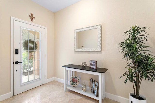 entryway featuring tile patterned floors and baseboards