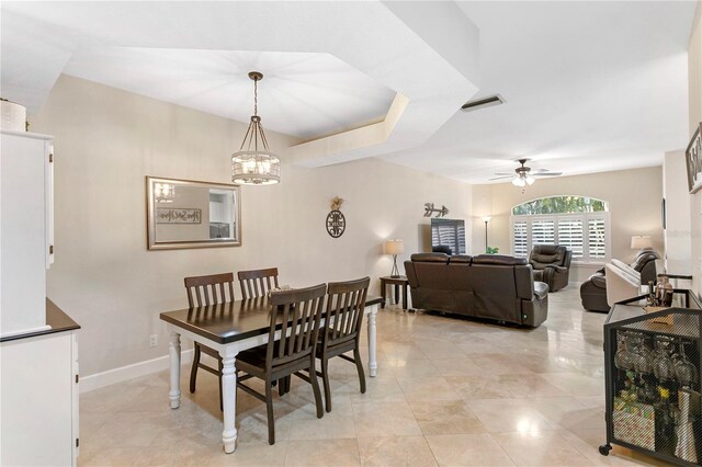 dining room with visible vents, baseboards, and ceiling fan with notable chandelier