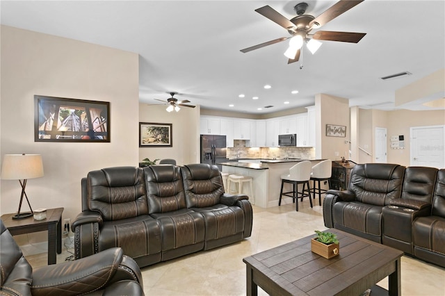 living area featuring recessed lighting, visible vents, ceiling fan, and light tile patterned floors