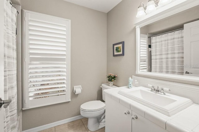 full bathroom with a shower with shower curtain, toilet, vanity, tile patterned flooring, and baseboards