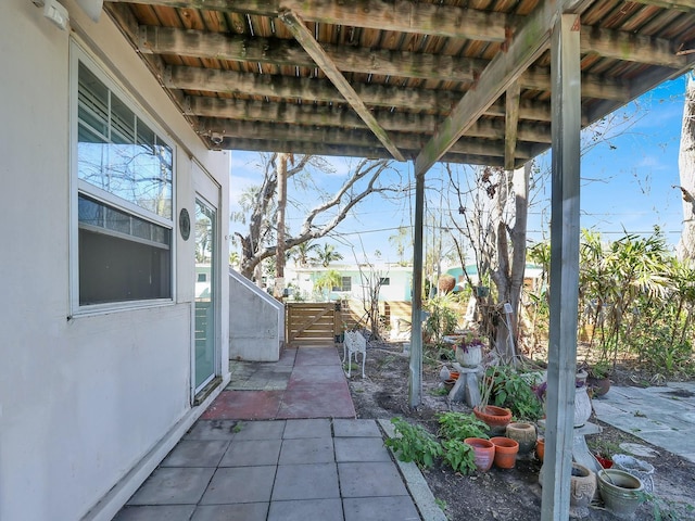 view of patio / terrace featuring fence