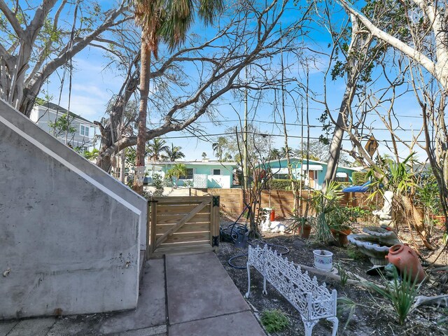 view of patio / terrace featuring fence and a gate