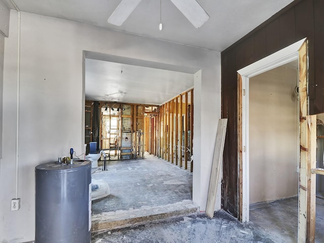 interior space featuring gas water heater and ceiling fan