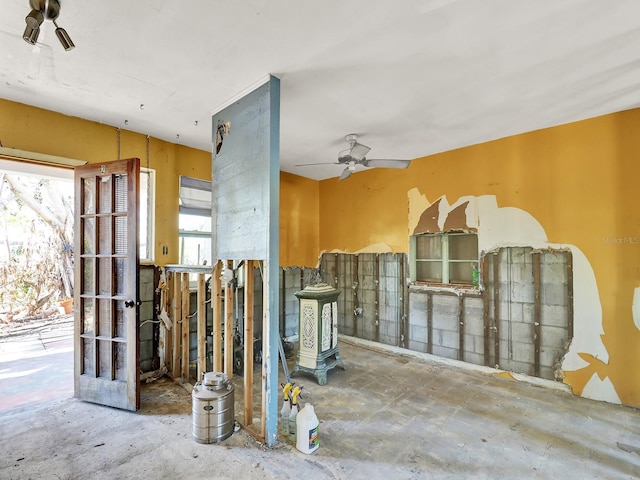 interior space with a ceiling fan