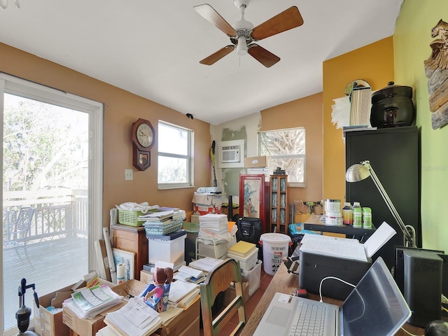 office with an AC wall unit, wood finished floors, and a ceiling fan