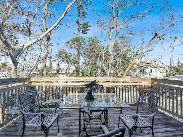 deck with outdoor dining area