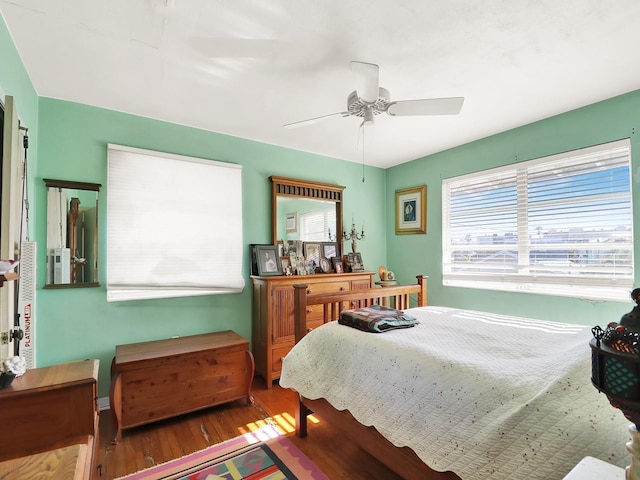 bedroom with wood finished floors and ceiling fan