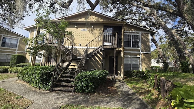 view of front of home with stairs