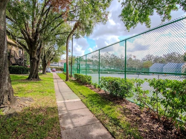 view of tennis court with fence