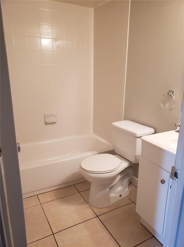 bathroom with vanity, tile patterned flooring, and toilet