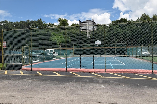 view of basketball court featuring community basketball court and fence