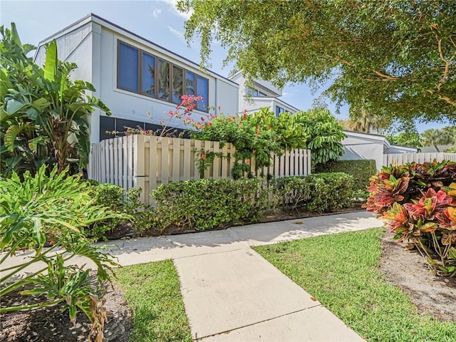 view of front of house featuring fence