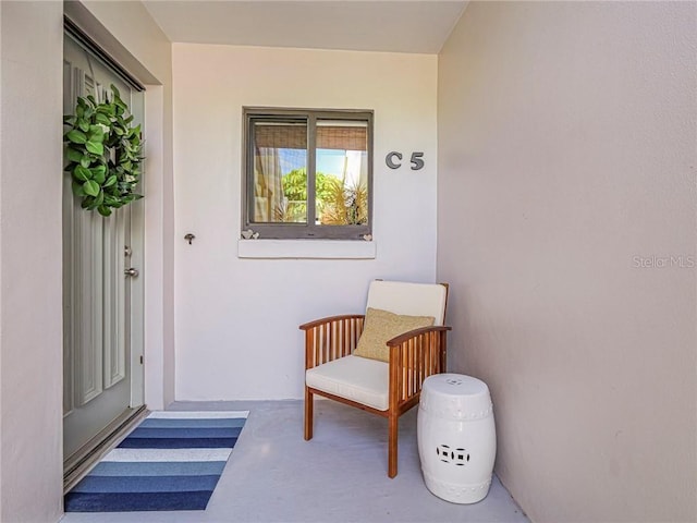 entrance to property with stucco siding