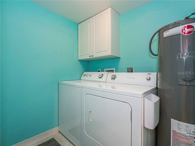 laundry room featuring cabinet space, baseboards, independent washer and dryer, water heater, and light tile patterned flooring