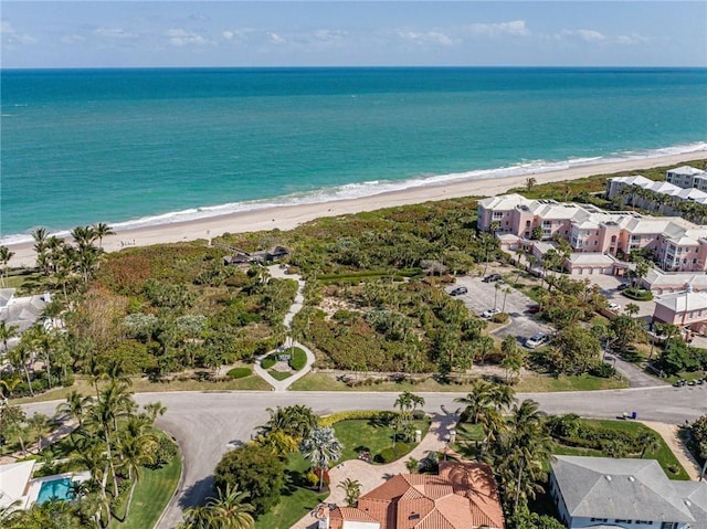 birds eye view of property featuring a view of the beach and a water view