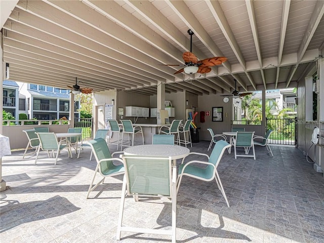 view of patio / terrace with a ceiling fan and outdoor dining space