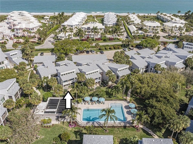 drone / aerial view featuring a residential view and a water view