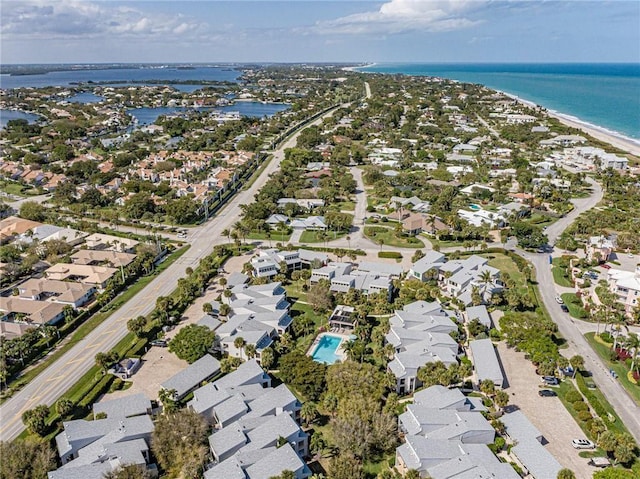 drone / aerial view featuring a residential view and a water view