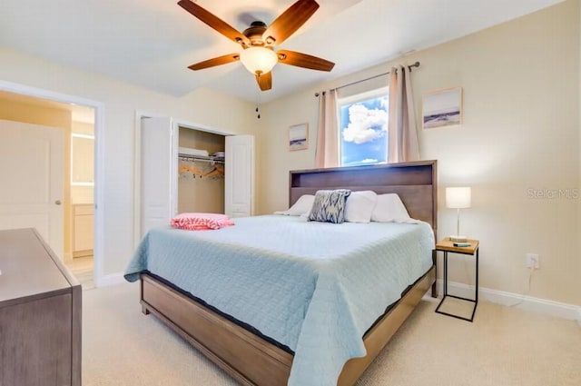 bedroom featuring light carpet, a closet, and baseboards