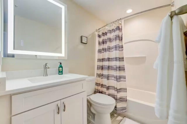 bathroom featuring vanity, toilet, and shower / tub combo with curtain