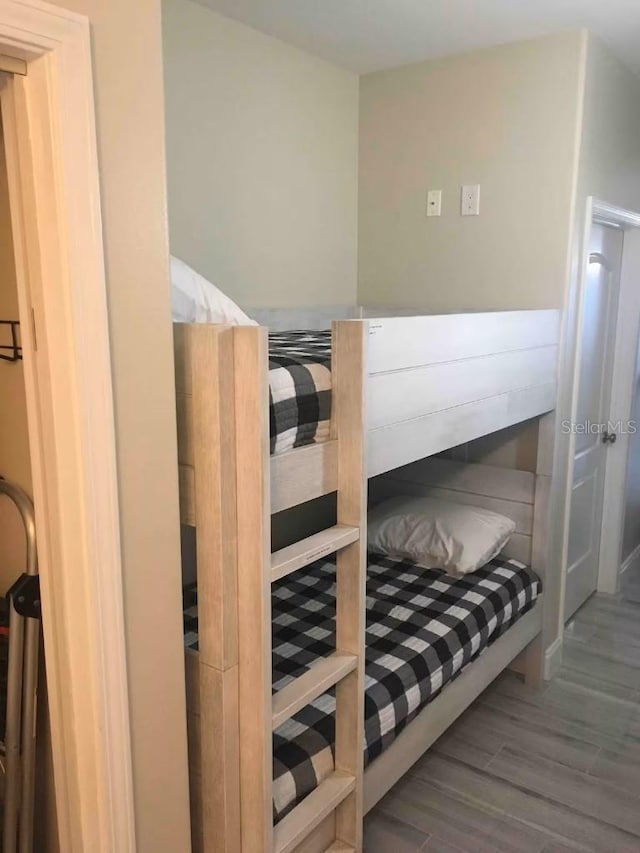 bedroom featuring wood finished floors