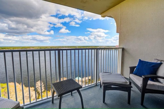 balcony featuring a water view