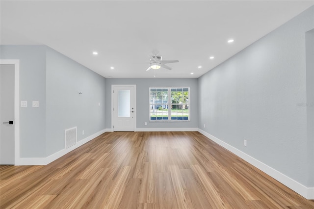 1842 Oklahoma Ave NE, Saint Petersburg, FL 33703 - unfurnished room with light wood finished floors, visible vents, baseboards, and a ceiling fan