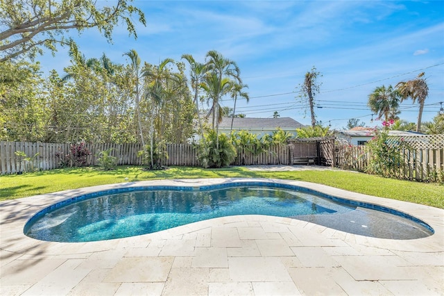 1842 Oklahoma Ave NE, Saint Petersburg, FL 33703 - view of swimming pool with a yard, a patio area, a fenced in pool, and a fenced backyard