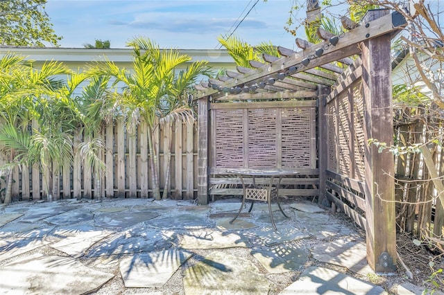 1842 Oklahoma Ave NE, Saint Petersburg, FL 33703 - view of patio / terrace featuring fence and a pergola