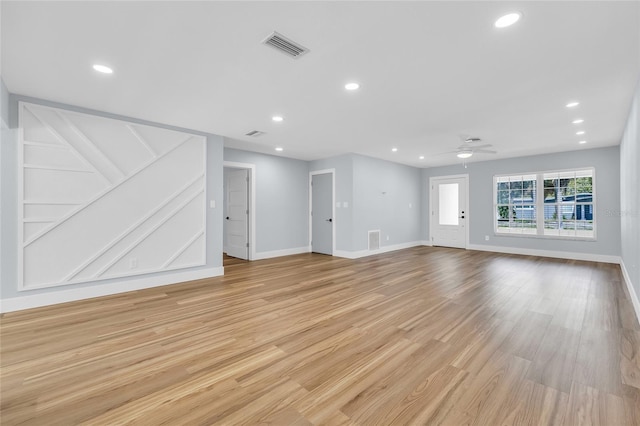 1842 Oklahoma Ave NE, Saint Petersburg, FL 33703 - unfurnished living room featuring ceiling fan, light wood-style flooring, and recessed lighting