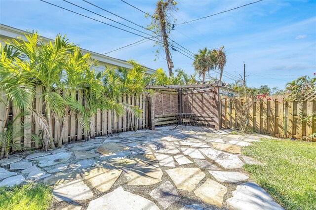 1842 Oklahoma Ave NE, Saint Petersburg, FL 33703 - fenced backyard with a patio area